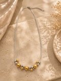 Collar de esferas bicolor dorado y plateado en acero inoxidable