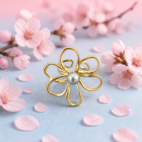 Anillo floral gold con perla plateada talla 7 rodeado de flores de cerezo