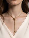 Collar lariat dorado con esferas deslizantes en acero inoxidable